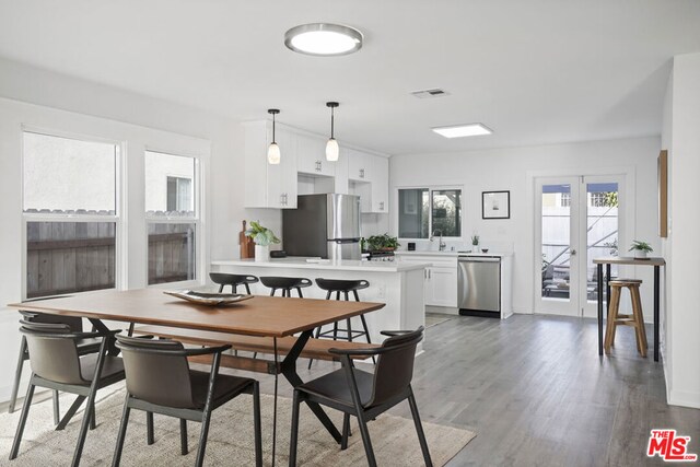 dining room featuring dark hardwood / wood-style flooring and sink