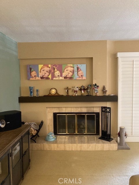 carpeted living room with a textured ceiling