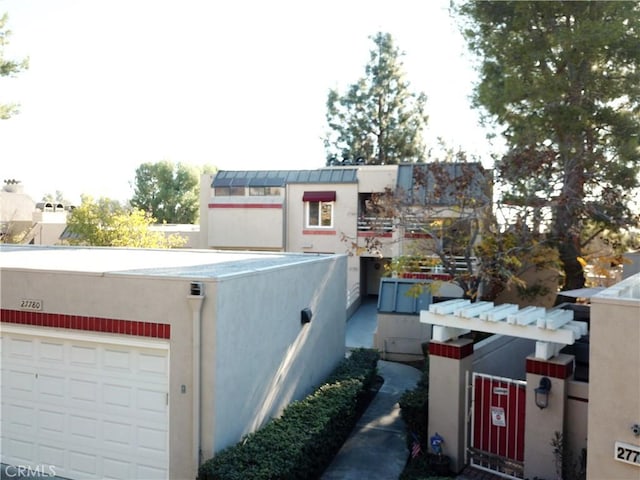 view of side of home featuring a garage