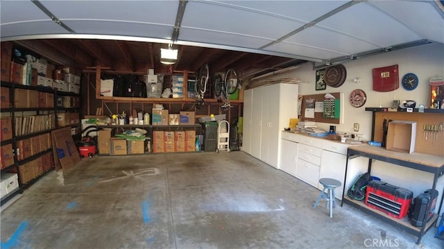 garage featuring a workshop area and a garage door opener