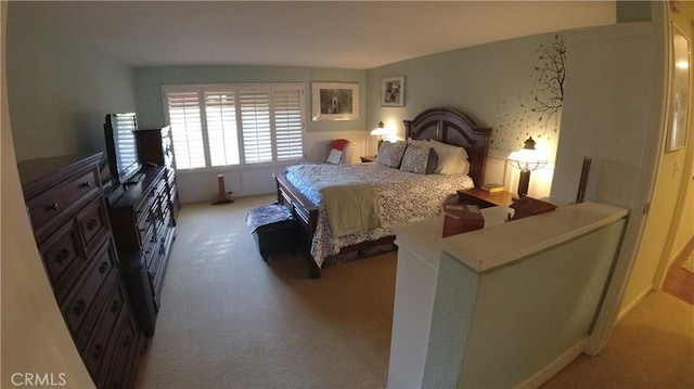 bedroom with light carpet