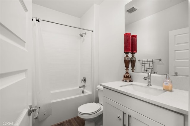 full bathroom with vanity, shower / bath combination, toilet, and hardwood / wood-style flooring