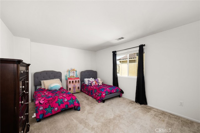 bedroom featuring light colored carpet