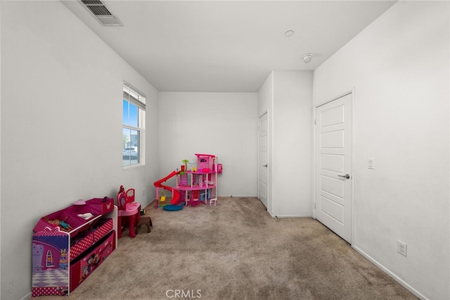 game room with light colored carpet