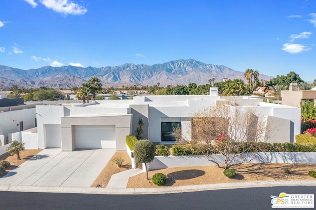 view of front of house featuring a mountain view and a garage