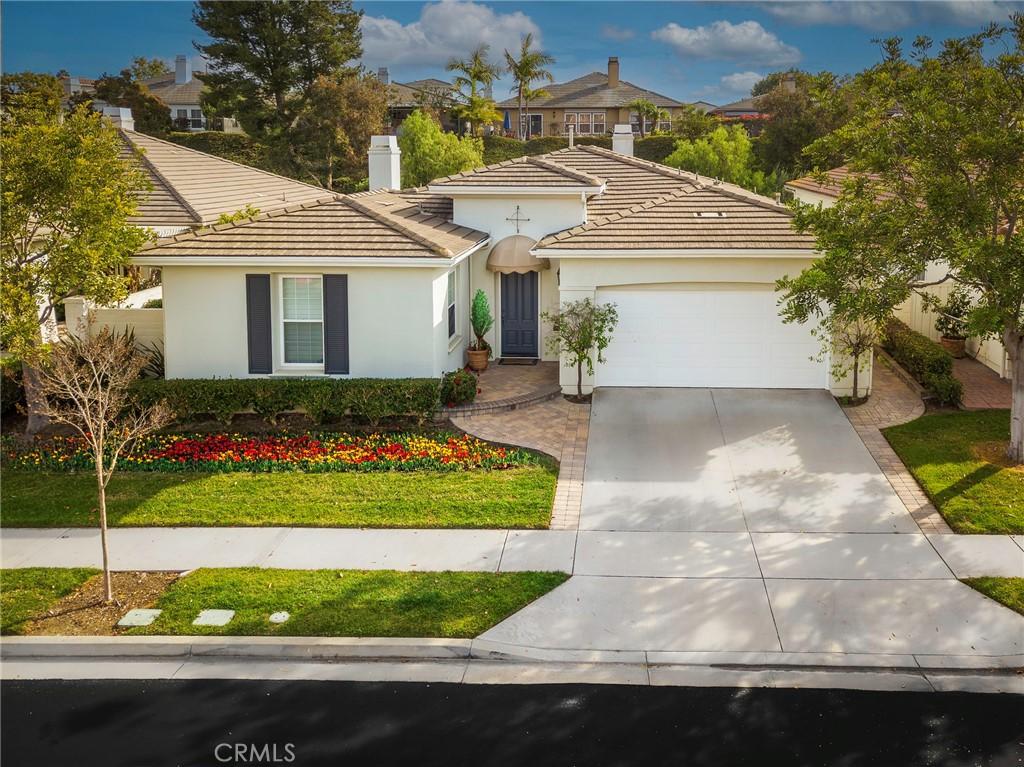 view of front of property with a front lawn and a garage