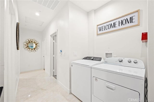 laundry area with independent washer and dryer