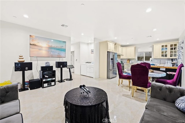 living room featuring washing machine and clothes dryer