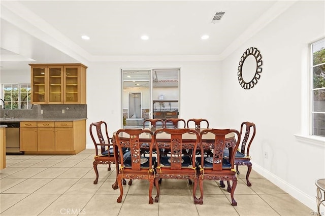 dining area featuring light tile patterned flooring