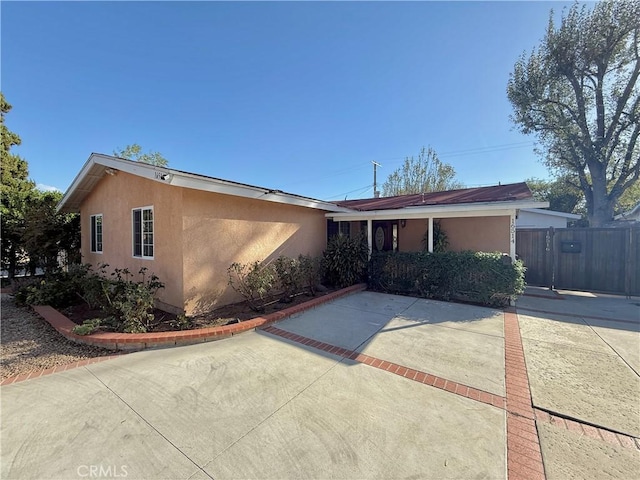 single story home featuring a patio area