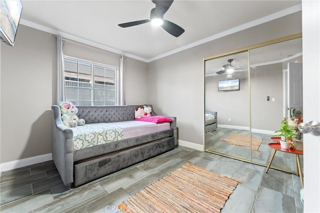 bedroom with ceiling fan, multiple windows, a closet, and ornamental molding