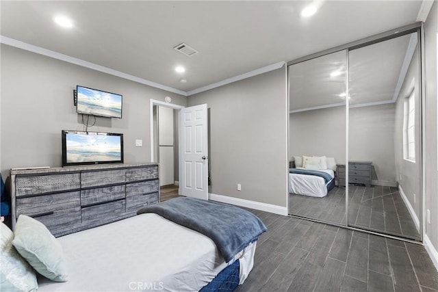 bedroom with a closet and crown molding