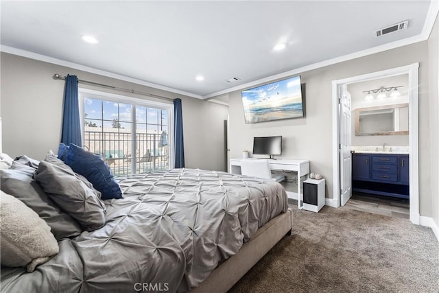 carpeted bedroom featuring sink, access to exterior, ensuite bathroom, and ornamental molding