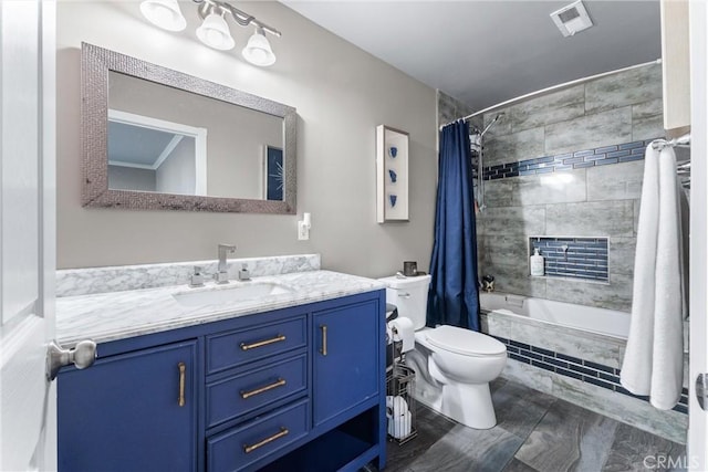 full bathroom featuring toilet, vanity, and shower / bath combo