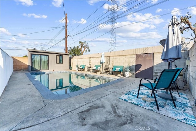 view of swimming pool with an outdoor structure