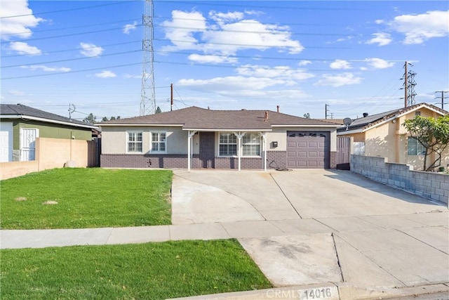 ranch-style home featuring a front lawn and a garage