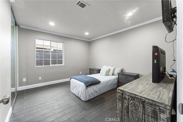 bedroom featuring dark hardwood / wood-style flooring and ornamental molding