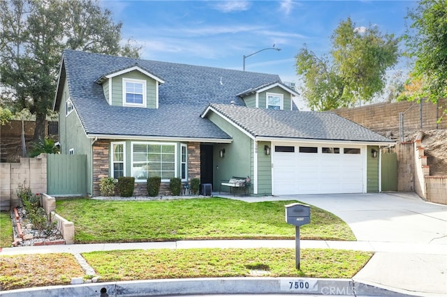 view of front facade with a front lawn and a garage