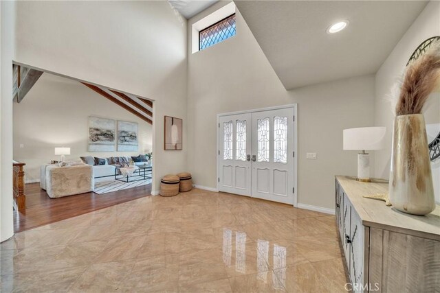 foyer entrance featuring a healthy amount of sunlight and french doors