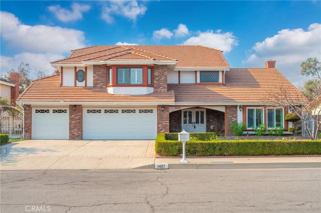 view of front of property with a garage