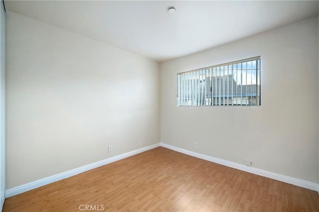 empty room featuring hardwood / wood-style floors