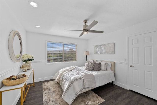 bedroom with ceiling fan and dark hardwood / wood-style floors