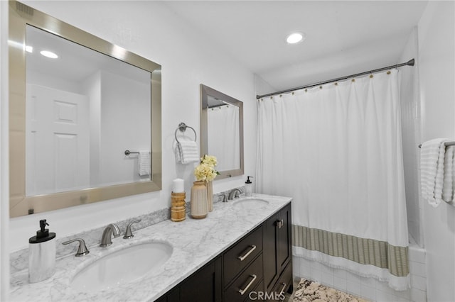 bathroom featuring vanity and shower / tub combo with curtain