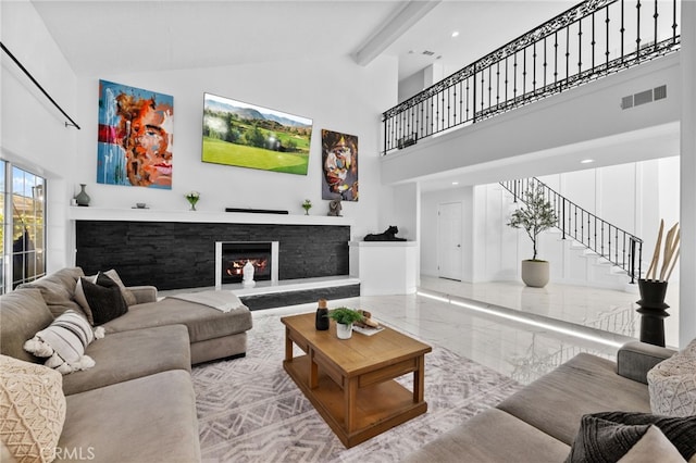 living room with a high ceiling