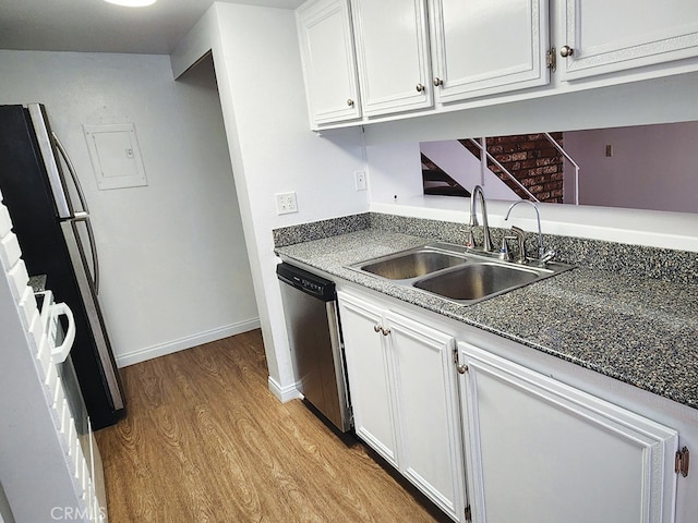 kitchen featuring dishwasher, sink, white cabinetry, and light hardwood / wood-style flooring