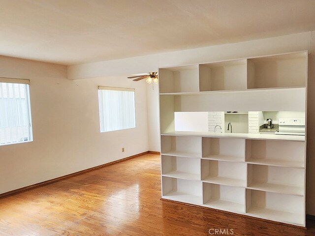 unfurnished room featuring ceiling fan and light hardwood / wood-style flooring