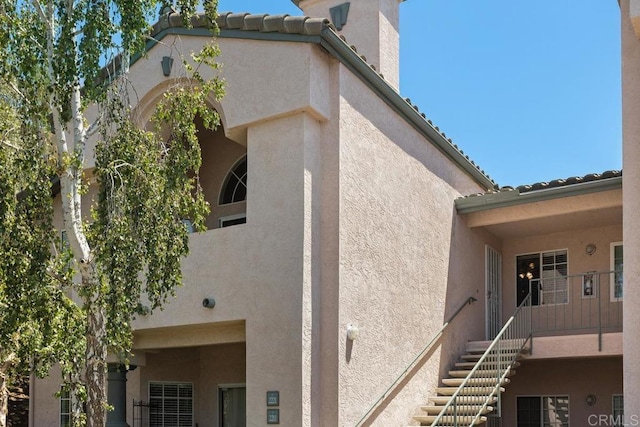 view of property exterior featuring a balcony