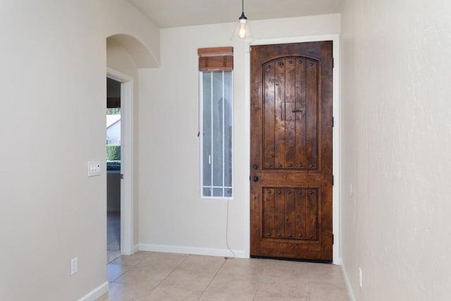 entryway with light tile patterned floors