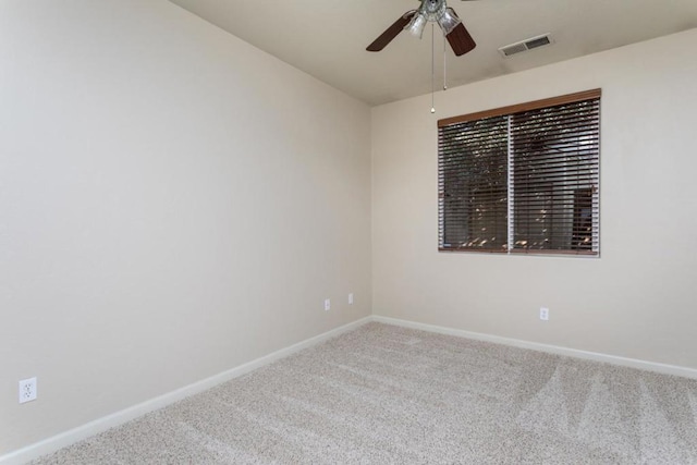 unfurnished room featuring ceiling fan and carpet