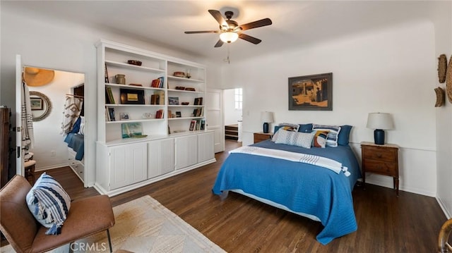 bedroom featuring ceiling fan, dark wood-type flooring, and ensuite bathroom