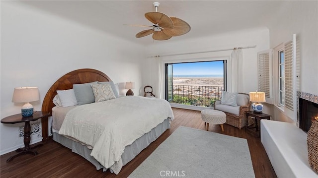 bedroom featuring ceiling fan and dark hardwood / wood-style flooring