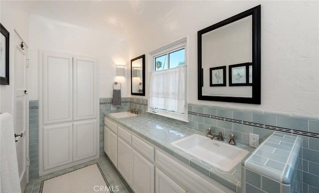 bathroom featuring vanity and tile patterned flooring