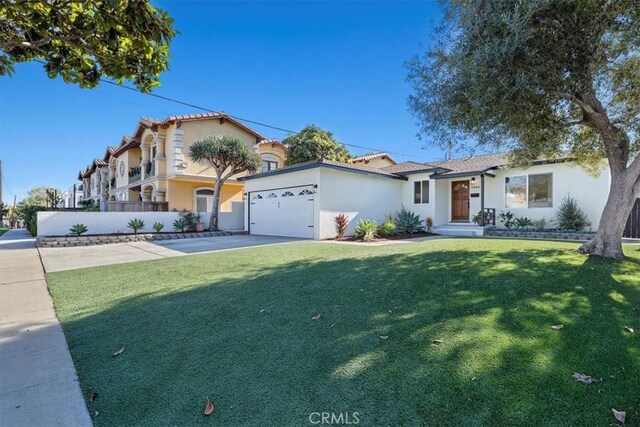 view of front of property with a garage and a front yard