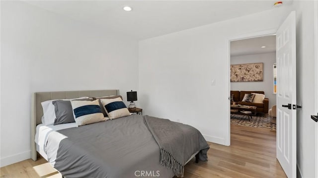 bedroom with light hardwood / wood-style floors