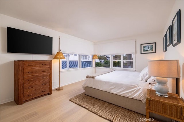 bedroom with light hardwood / wood-style flooring