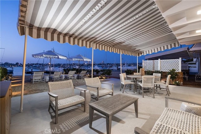 view of patio terrace at dusk