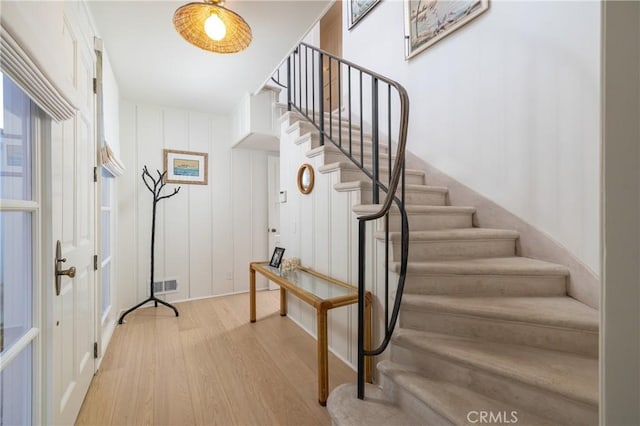 stairway featuring hardwood / wood-style floors