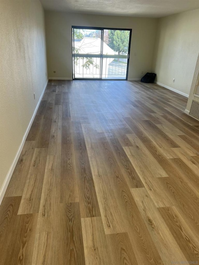 spare room featuring hardwood / wood-style flooring