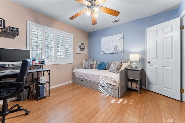 bedroom featuring ceiling fan and light hardwood / wood-style floors