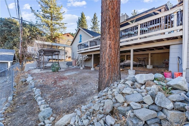 back of house featuring a deck