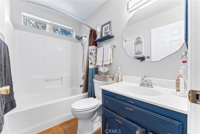 full bathroom featuring toilet, vanity, shower / tub combo with curtain, and hardwood / wood-style floors