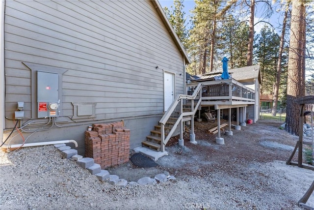 view of home's exterior with a wooden deck