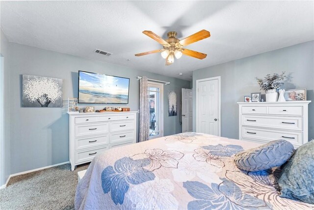 bedroom featuring ceiling fan and carpet