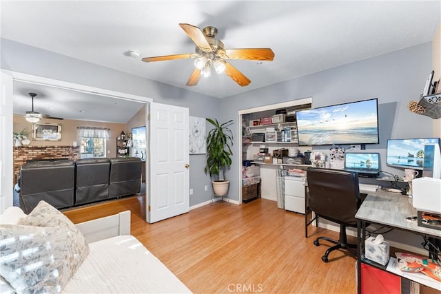 office featuring ceiling fan and light hardwood / wood-style flooring