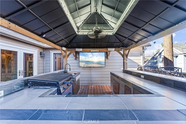 view of patio / terrace featuring a gazebo, french doors, and sink