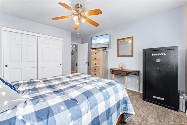 carpeted bedroom featuring ceiling fan and a closet